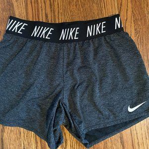 Grey, black, and white Nike shorts